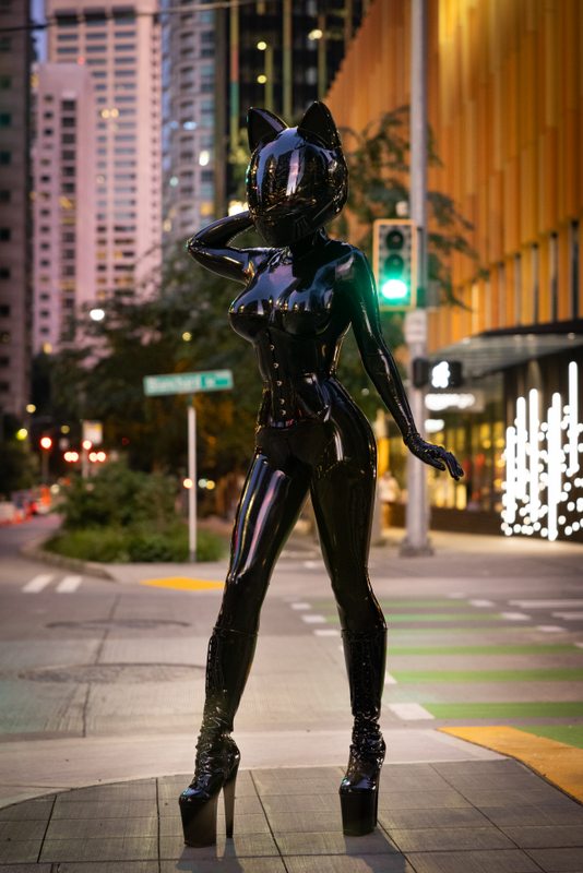 A sexy photograph of Vespa in black latex. Tagged with: space kitten, moto helmet & in public. Posted September 2021.