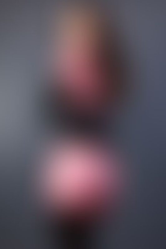 A sexy photograph of Vauntastic in transparent &amp; purple & pink latex. Posted December 2021.