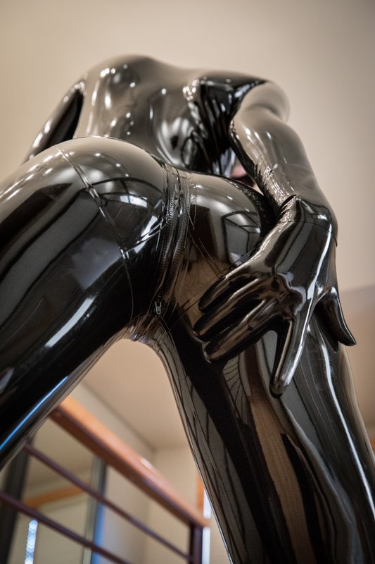 A sexy photograph of Cam Damage, in black latex. Posted March 2018.